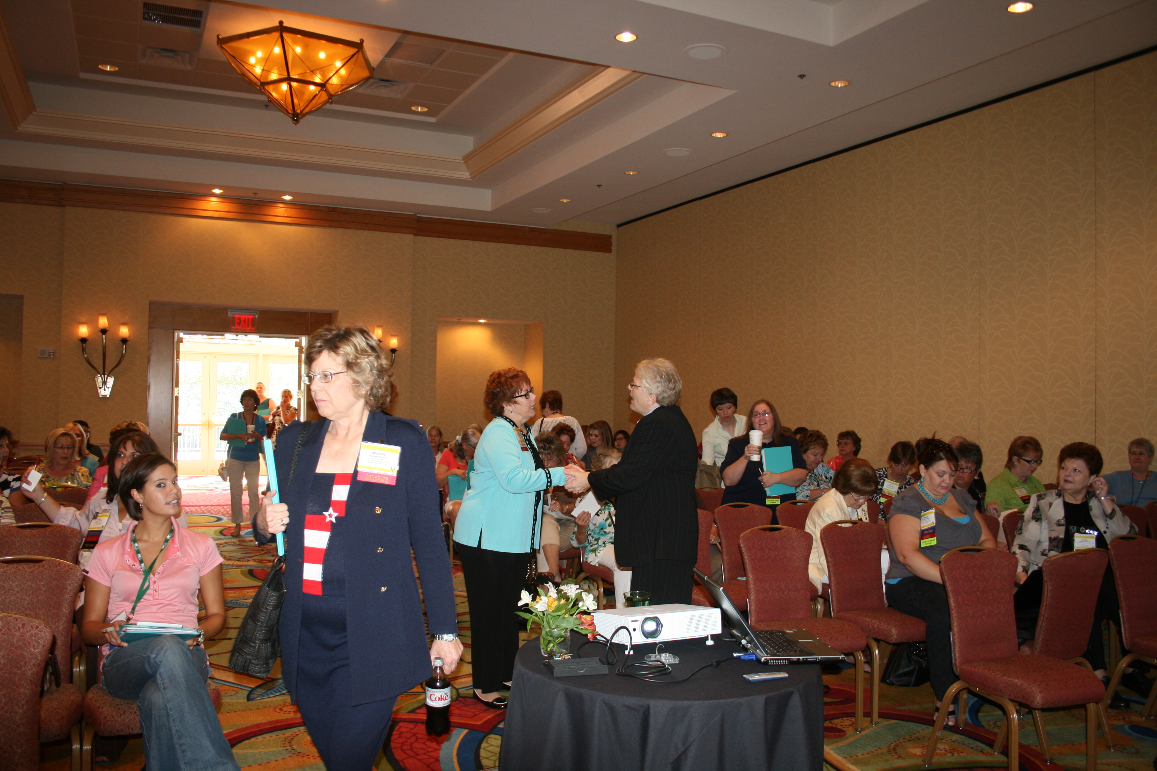 Carol Hagen greets Judy DeWeese 